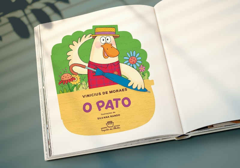 livros aberto com desenho referente ao poema o pato de Vinicius de Moraes