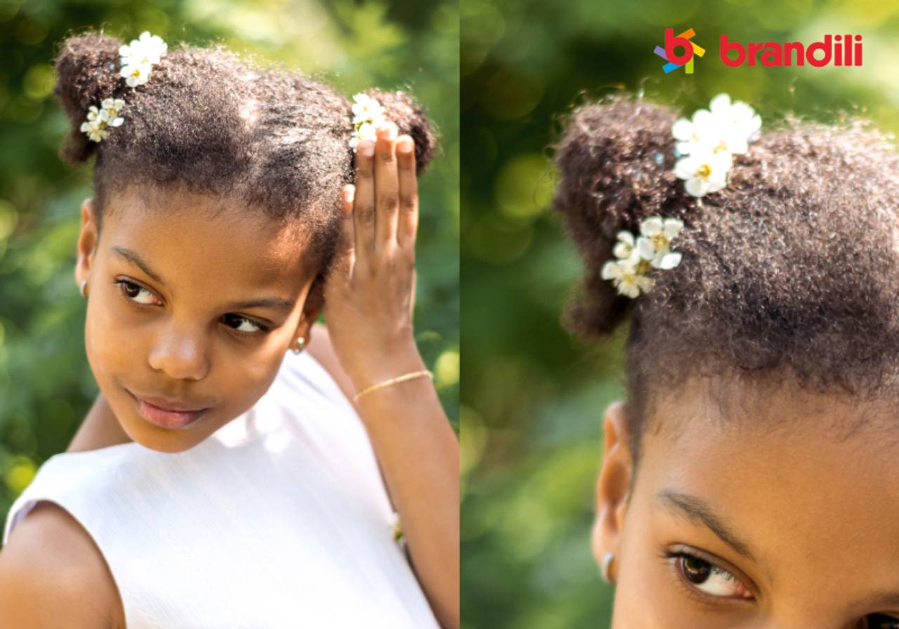 menininha negra com coque duplo e flores 